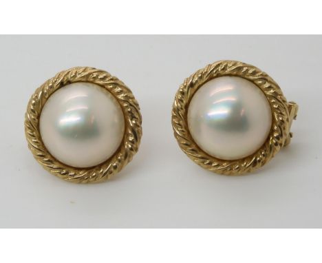 A pair of yellow metal mabe pearl earrings Condition Report:Available upon request