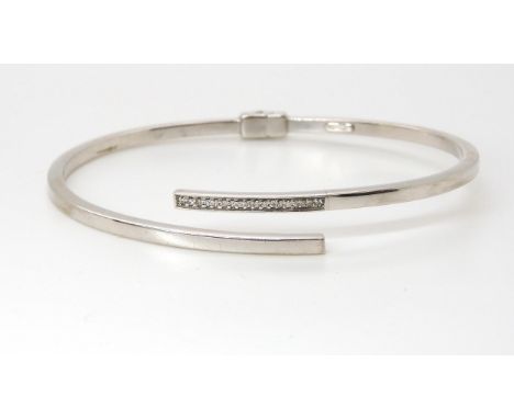 An Italian made 9ct white gold diamond accent bangle, weight 6.1gms Condition Report:Available upon request
