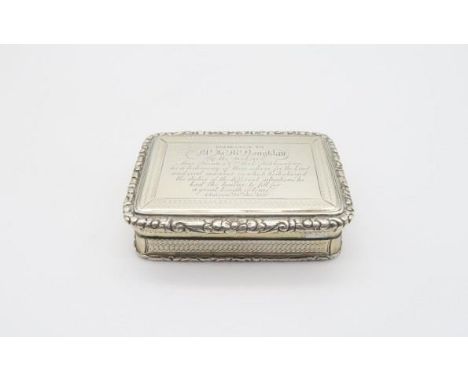 A George III silver snuff box, of rectangular form with moulded floral borders, the body engine turned, with engraved present