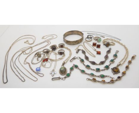 A collection of silver and white metal mounted jewellery to include green agate, tiger's eye, garnet and labradorite, and a s
