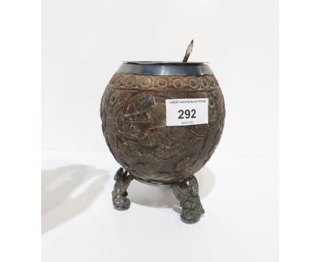 A Burmese carved coconut bowl, decorated with panels of peacocks and deities, with a banded line of flowers, EPNS lined, supp