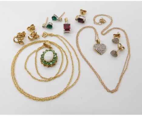 A collection of 9ct gold and yellow metal items to include a diamond set heart pendant and earrings, opal and emerald pendant