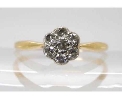 A vintage 18ct gold diamond flower cluster ring, set with estimated approx 0.25cts of brilliant cut diamonds, size R, weight 