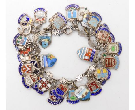 An extensive silver and enamel place name charm bracelet Condition Report:Not available for this lot.