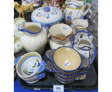 A collection of Quimper pottery including quaich's, jugs etc Condition Report:Not available for this lot.
