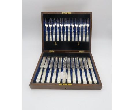 A cased canteen of mother of pearl and EPNS handled fruit knives and forks, the blades engraved with vine decoration, the cas