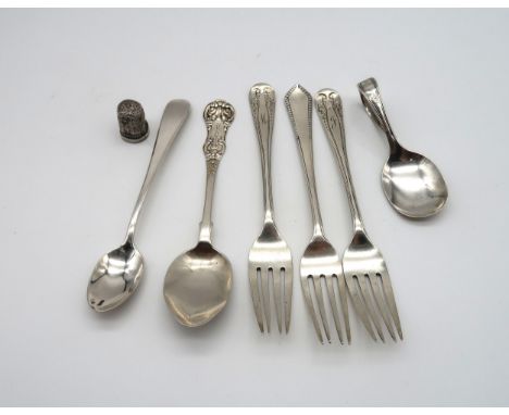 A small collection of silver flatware including two forks by Duncan &amp; Scobie, Sheffield 1919, another fork, a thimble, a 