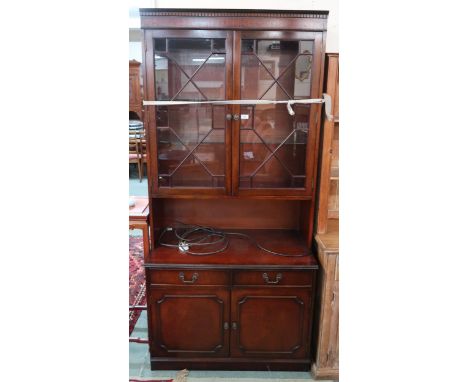 A 20th century mahogany wall unit and an Oriental style jardinière stand (2) Condition Report:Available upon request