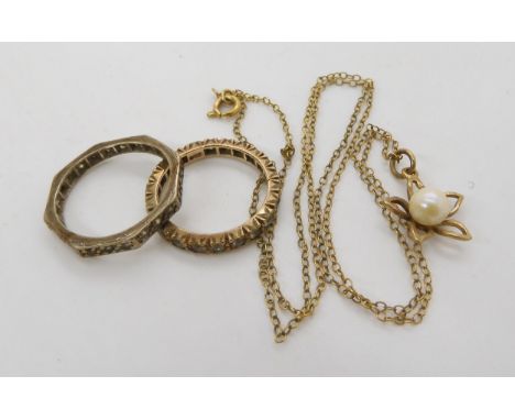 A 9ct octagonal shaped clear gem set eternity ring, size N, together with another size L1/2, and a 9ct pearl pendant and chai