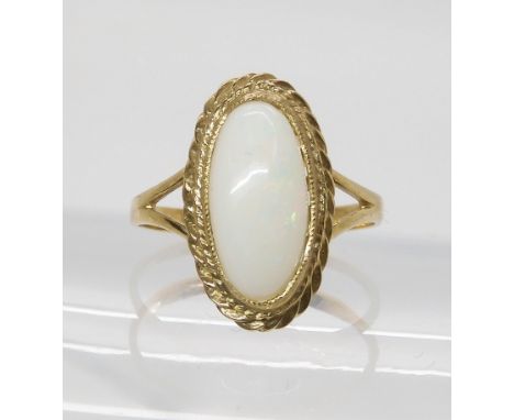 A 9ct gold white opal ring, size P, weight 3gms Condition Report:Available upon request