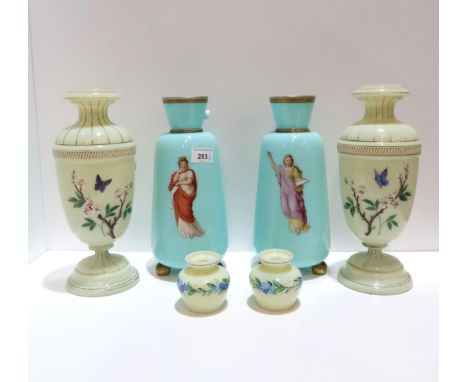 A pair of Victorian glass vases, each with enamel decoration of a maiden, a pair of butterfly vases and a pair of posy vases 