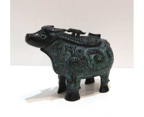 A Chinese bronze vessel modelled as Bull Zun, with wood stand, in presentation box  Bought from the Alex Salmond charity auct