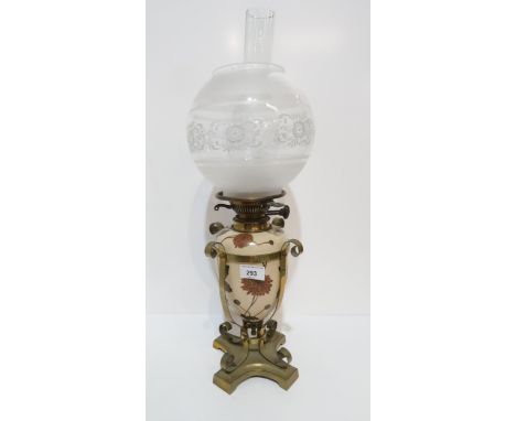 A ceramic and brass cased oil lamp, the body decorated with flowers, with a frosted glass shade, 58cm Condition Report:Availa