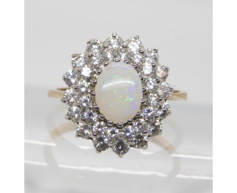 A 9ct gold cz and white opal cluster ring, size N, weight 2.6gms Condition Report:Available upon request