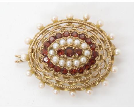A 9ct gold garnet and pearl pendant brooch, length 4.5cm, weight 11.8gms Condition Report:Available upon request