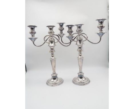 A pair of silver plated three light candelabra, in the Georgian style, 42cm (2) Condition Report:Available upon request