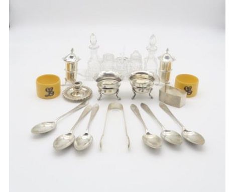 A collection of silver including a set of coffee spoons and sugar tongs with engraved floral decoration, the terminal monogra