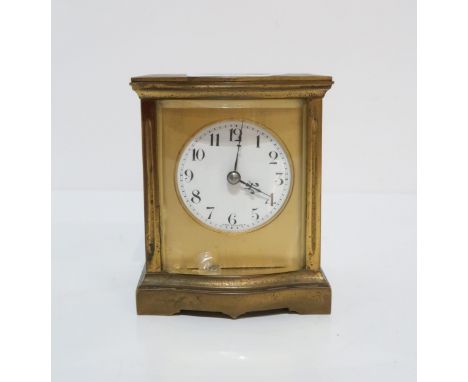 A French brass &amp; glass bowfront carriage clock, 9cm high Condition Report:winds and ticks, glass chiped to front