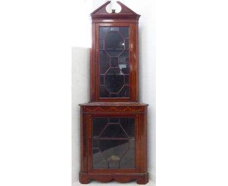 An Edwardian freestanding mahogany corner cupboard with boxwood-stringing and marquetry decoration:&nbsp;the 15-panel astraga