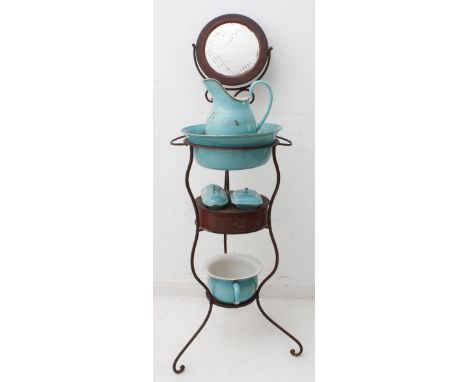An early 20th century French wrought-iron washstand with ceramic washbowl and basin, toothbrush holder, soap dish and chamber