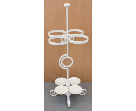 A white-painted modern four-division iron-work stick stand.