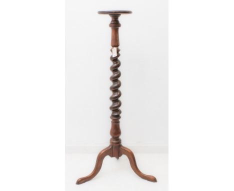 An early 20th century mahogany torchère with small dished circular top, barley-twist stem and tripod base. (128 cm high)(One 