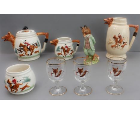 A mixed lot of eight hunting themed pieces:1. a three-piece ceramic tea service with foxhunting decoration in high relief and