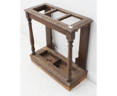 A late 19th/early 20th century carved oak three-division stick stand for restoration