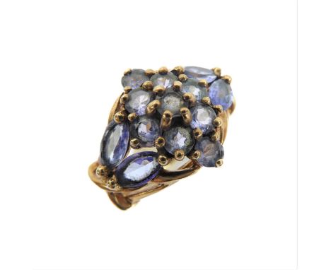 A 9 carat gold ring set with cut stones (possibly tanzanite), size K (boxed)