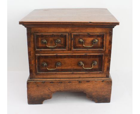 An 18th century fruitwood box (converted); two half-width over a single full-width false drawer, two swan-neck carrying handl