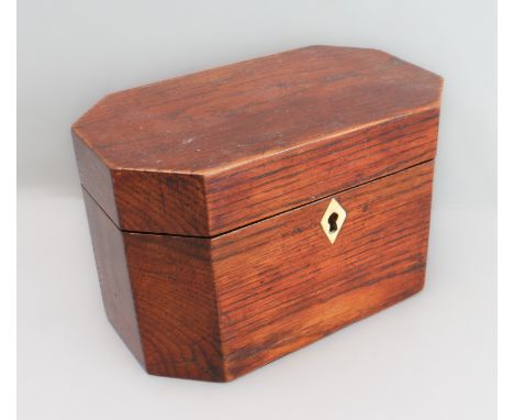 A late 18th century octagonal oak tea caddy with unusual division and Anglesey kite-shaped bone escutcheon&nbsp;