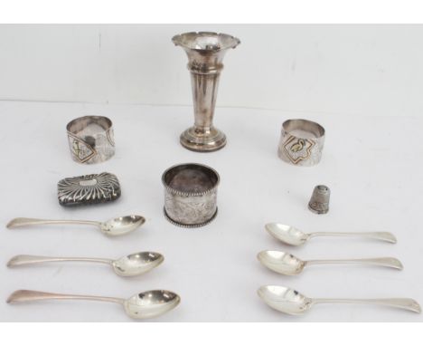 Hallmarked silver comprising:an interesting pair of late 19th century napkin rings decorated in relief in the Japanese taste 