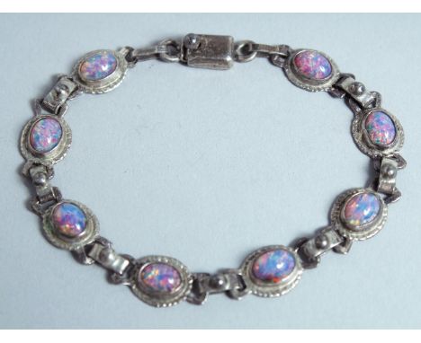 A SILVER AND OPAL BRACELET.