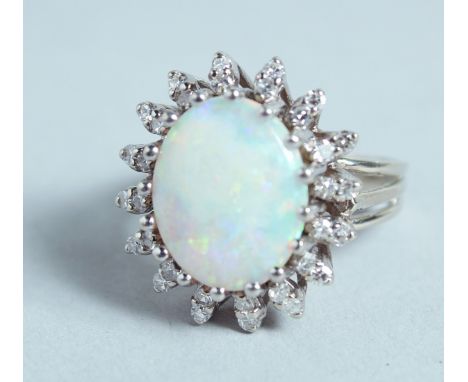 AN 18CT WHITE GOLD, OPAL, AND DIAMOND CLUSTER RING.