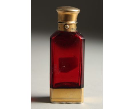 A VICTORIAN RUBY GLASS SILVER MOUNTED FLASK VINAIGRETTE. 3.5ins long. London 1863