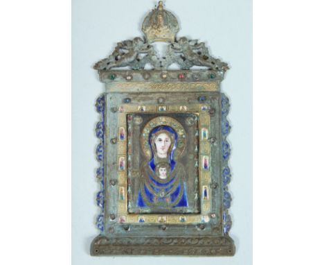 A SUPERB QUALITY GILT AND ENAMEL ICON, the metal frame with cupids and crown. 4ins x 2ins overall in a folding leather case.