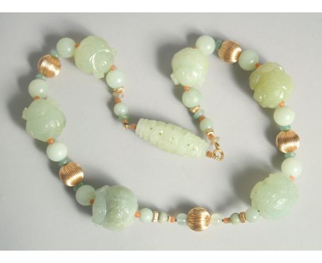 A SUPERB CHINESE JADE AND GOLD NECKLACE set with six long carved jade stones in set with small jade beads and five gold beads