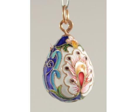 A SILVER AND ENAMEL EGG PENDANT.