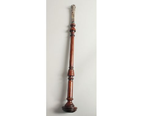A TURNED WOOD AND SILVER TIPSTAFF. 20ins long.