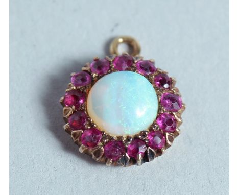 A RUBY AND OPAL CIRCULAR PENDANT.