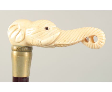 A WALKING STICK with cared bone handle 'ELEPHANT'. 2ft 8ins long.