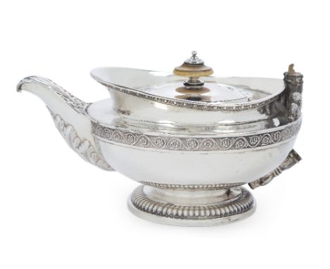 A George III silver teapot by Paul Storr, London, 1816, raised on a lobed circular foot, the teapot designed with egg-and-dar