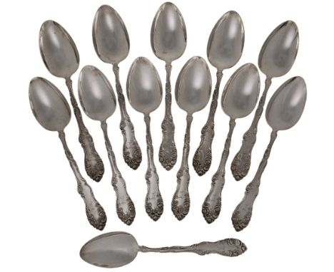 A set of twelve Canadian silver table spoons, P.W. Ellis & Co., Ontario, 1872-1928, with floral scroll decoration to stems an