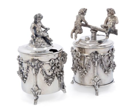 A 19th century French mustard and pepper-grinder, 950 standard, maker CM, the cylindrical body of each applied with floral sw