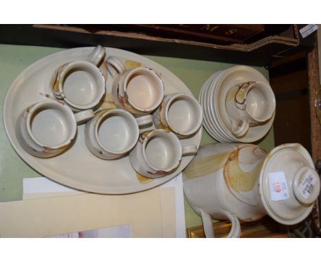 POTTERY COFFEE SET INCLUDING COFFEE POT AND SEVEN CUPS AND SAUCERS