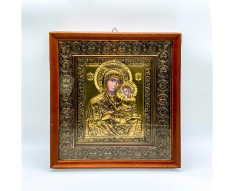 Housed in wooden frame. Ornately decorated metal on print. Depicting Mary holding the baby Jesus in her arm. Sight size: 8.75