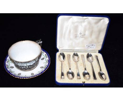 A GEORGE V ROYAL WORCESTER SILVER HELD CUP WITH SAUCER The silver with open work pattern detail featuring a squirrel bird and