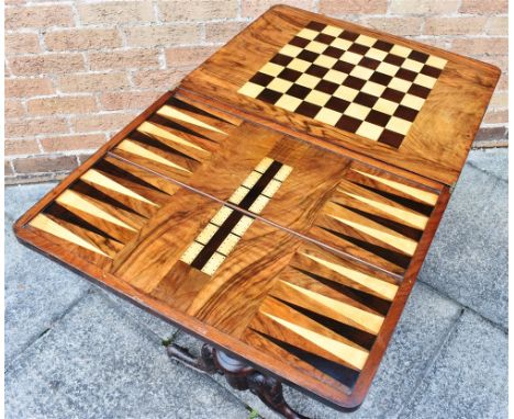 VICTORIAN GAMES/SEWING TABLE the foldout top revealing the games top for backgammon, chess and cribbage, with fitted frieze d