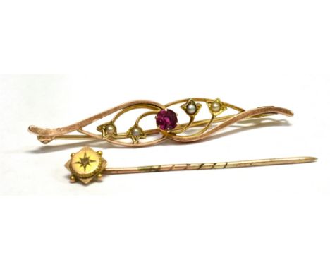 AN UNMARKED ROSE GOLD BAR BROOCH  Together with a marked 9ct diamond set stickpin, the bar brooch set with a red gemstone and