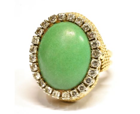 A LARGE GREEN AND CRYSTAL PASTE SET COCKTAIL RING  set in yellow metal marked ITALY K 18, ring size P ½ , weight approx. 15.6